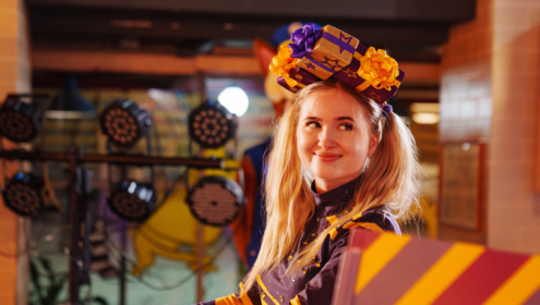 a woman smiling on a stage
