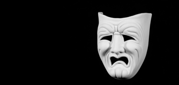 a tragedy mask, clearly looking upset about some bad acting