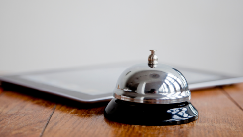 a hotel bell and ipad, presumably for someboyd checking in